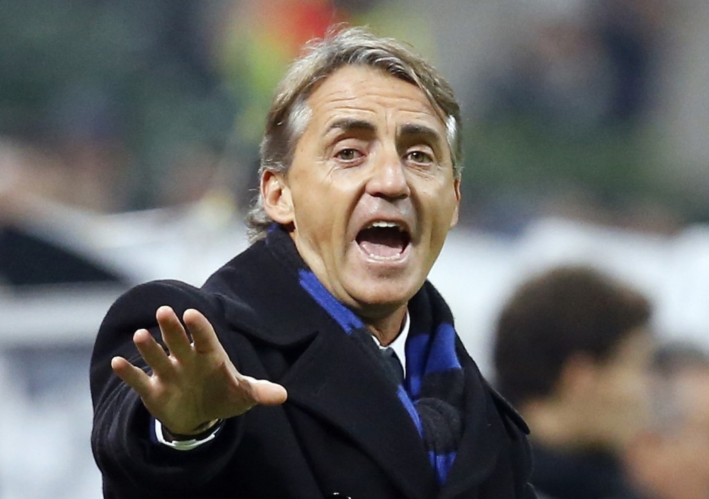 Inter Milan's coach Mancini gestures during their Italian Serie A soccer match against AC Milan at the San Siro stadium in Milan